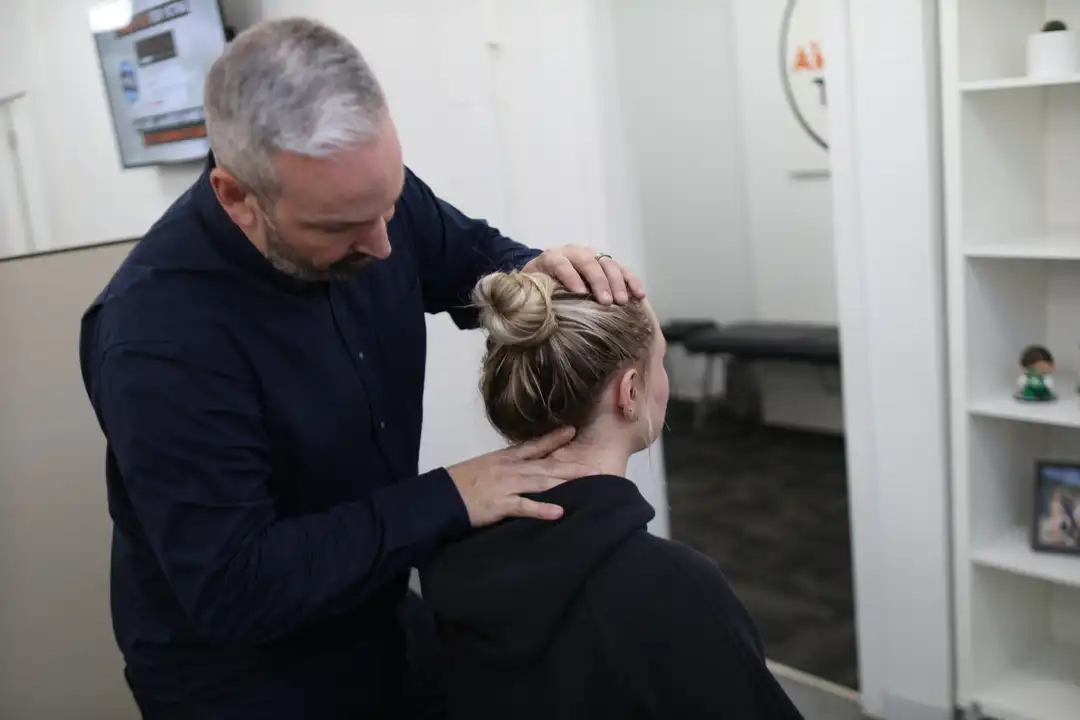 Dr. Alain Desaulniers adjusting a patient at Revolution Health in Vancouver