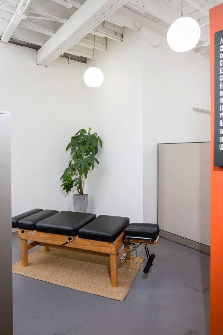 A chiropractic table at Revolution Health